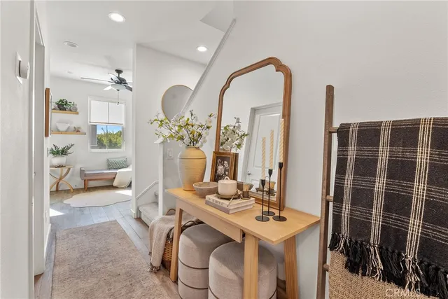 a bedroom with a bed and a flat tv screen on the dresser