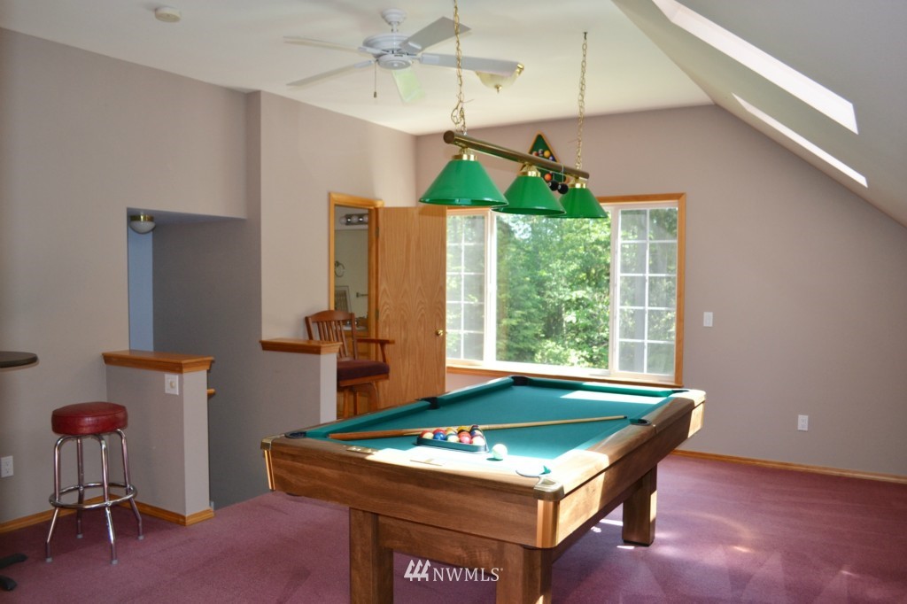2469 Goss Ridge Road Freeland, WA 98249 - Photo 13 of 25 a room with pool table and windows