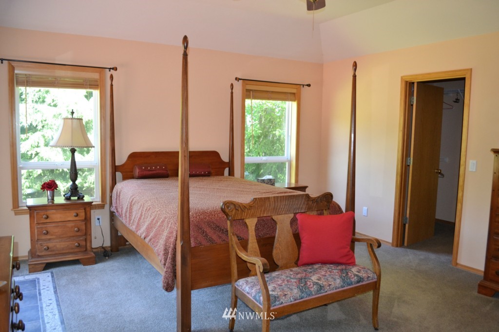 2469 Goss Ridge Road Freeland, WA 98249 - Photo 15 of 25 a bedroom with a bed and window