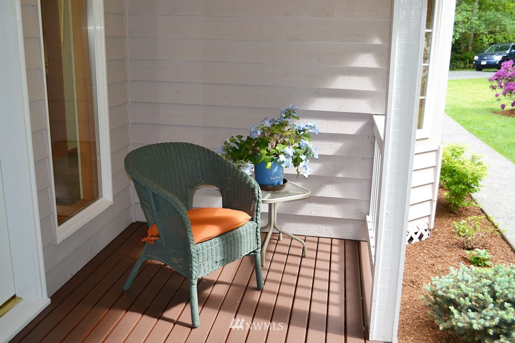2469 Goss Ridge Road Freeland, WA 98249 - Photo 3 of 25 a balcony with table and chairs and potted plants