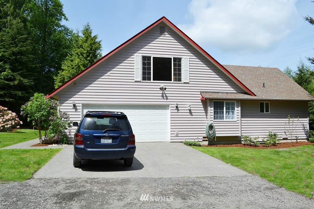 2469 Goss Ridge Road Freeland, WA 98249 - Photo 23 of 25 a car parked in front of a house