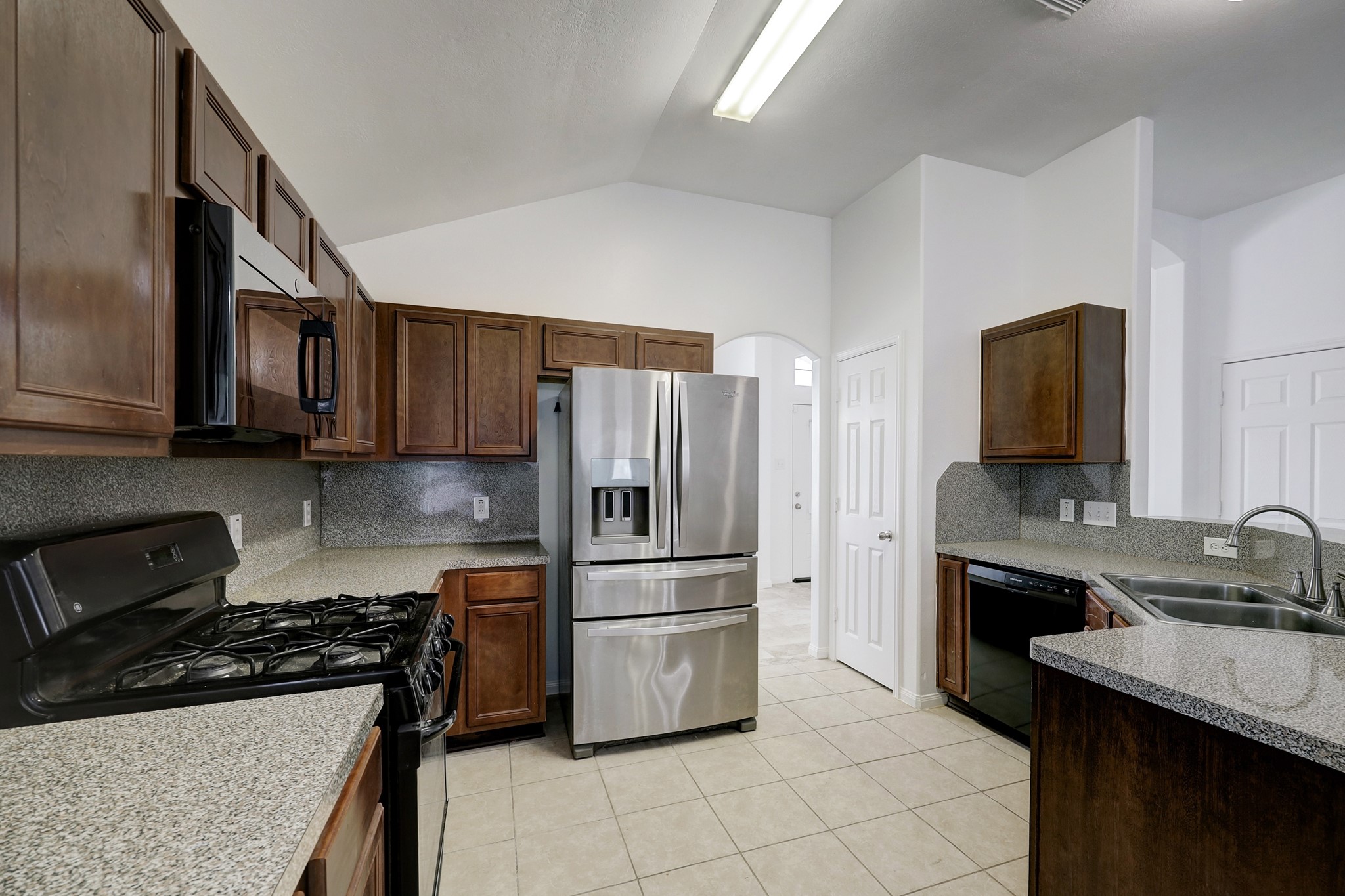 25407 Clover Ranch Drive Katy, TX 77494 - Photo 5 of 17 Kitchen includes fridge, dishwasher and gas range