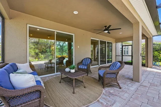 a outdoor living space with furniture and a large window