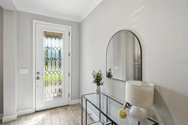a view of entryway with wooden floor