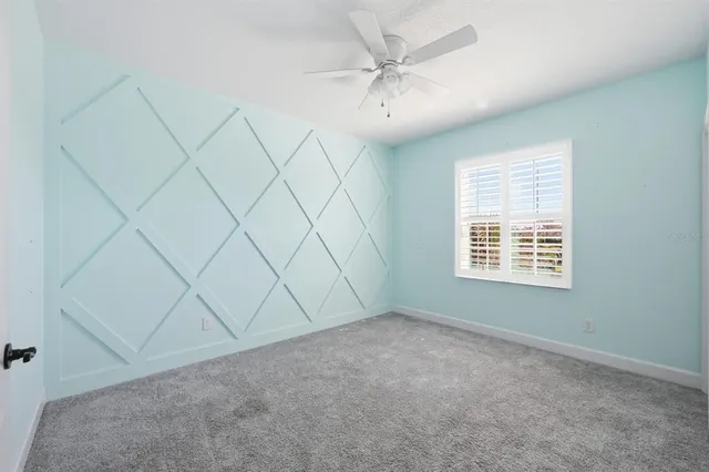 a bathroom with a granite countertop sink mirror and a bathtub