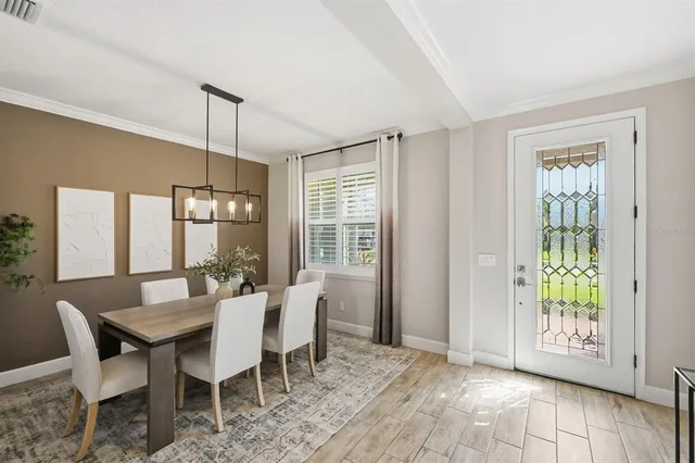 a view of a dining room with furniture window and outside view