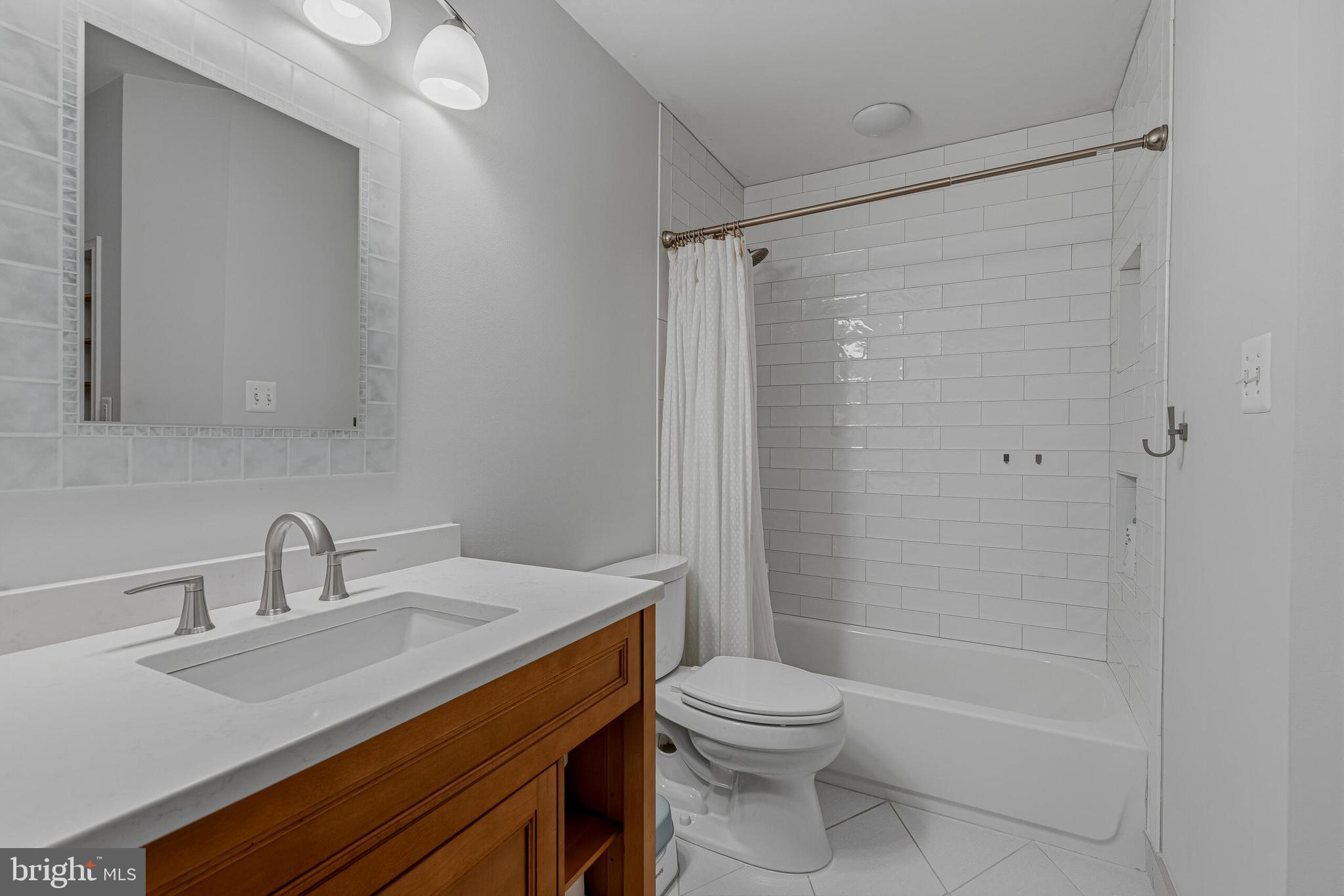 1403 Harle Place Southwest Leesburg, VA 20175 - Photo 18 of 41 a bathroom with a sink a toilet and shower