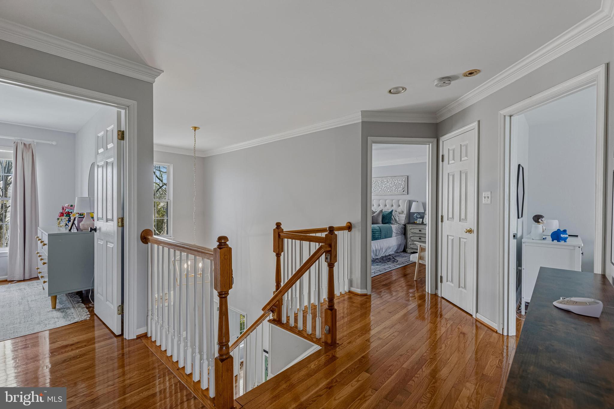 1403 Harle Place Southwest Leesburg, VA 20175 - Photo 21 of 41 a view of a hallway with wooden floor and stairs