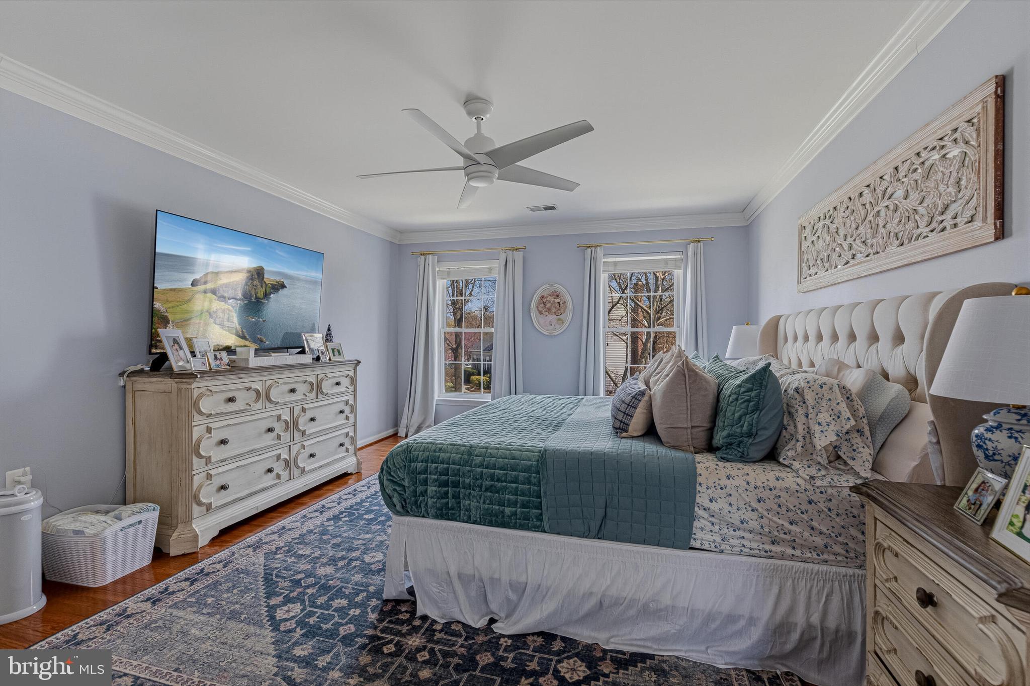 1403 Harle Place Southwest Leesburg, VA 20175 - Photo 25 of 41 a bedroom with a bed and wooden floor