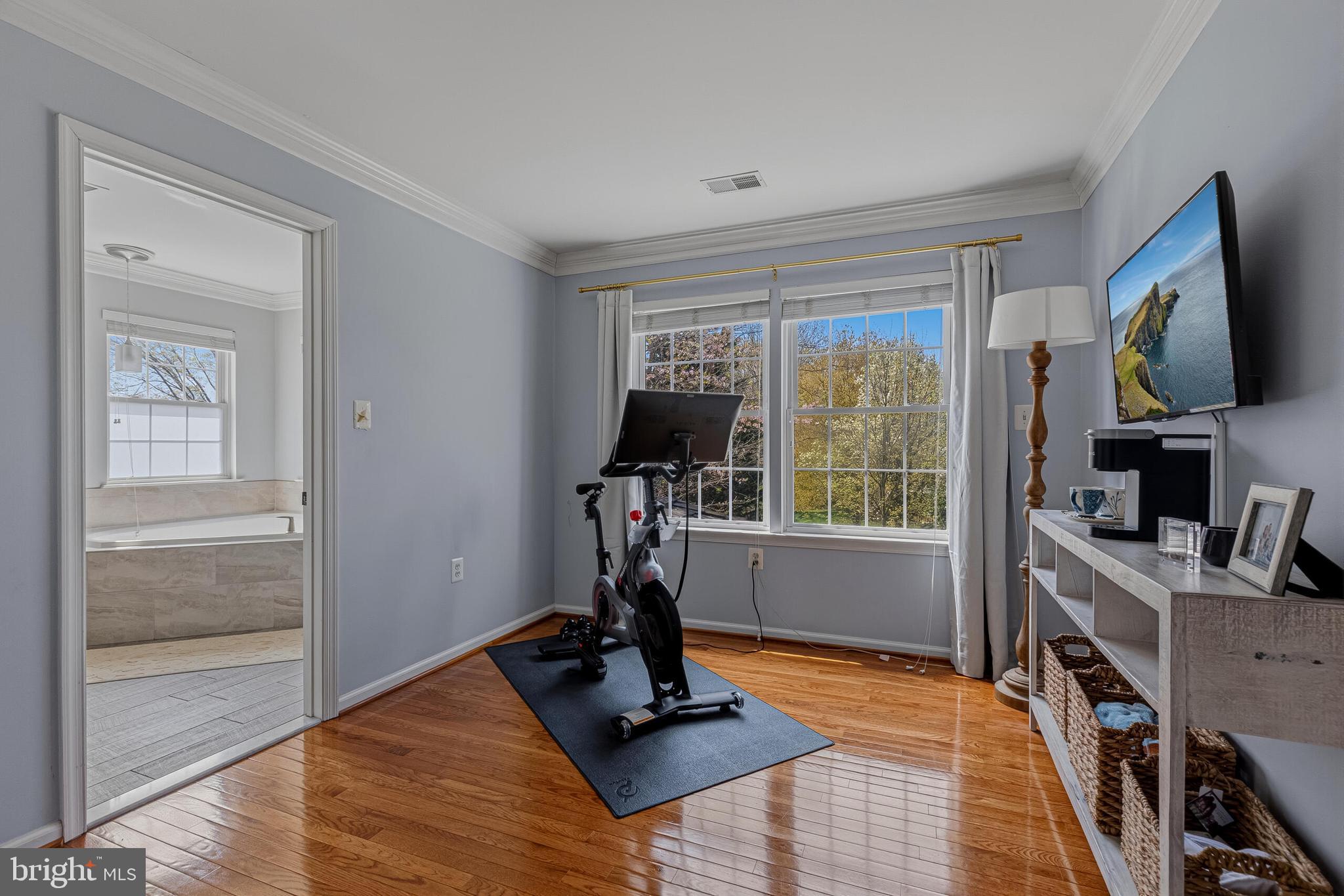 1403 Harle Place Southwest Leesburg, VA 20175 - Photo 27 of 41 a view of a room with gym equipment and windows