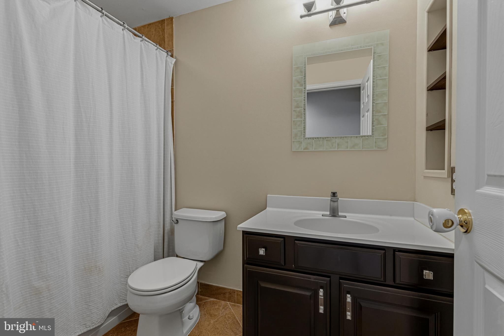 1403 Harle Place Southwest Leesburg, VA 20175 - Photo 30 of 41 a bathroom with a sink toilet and a mirror
