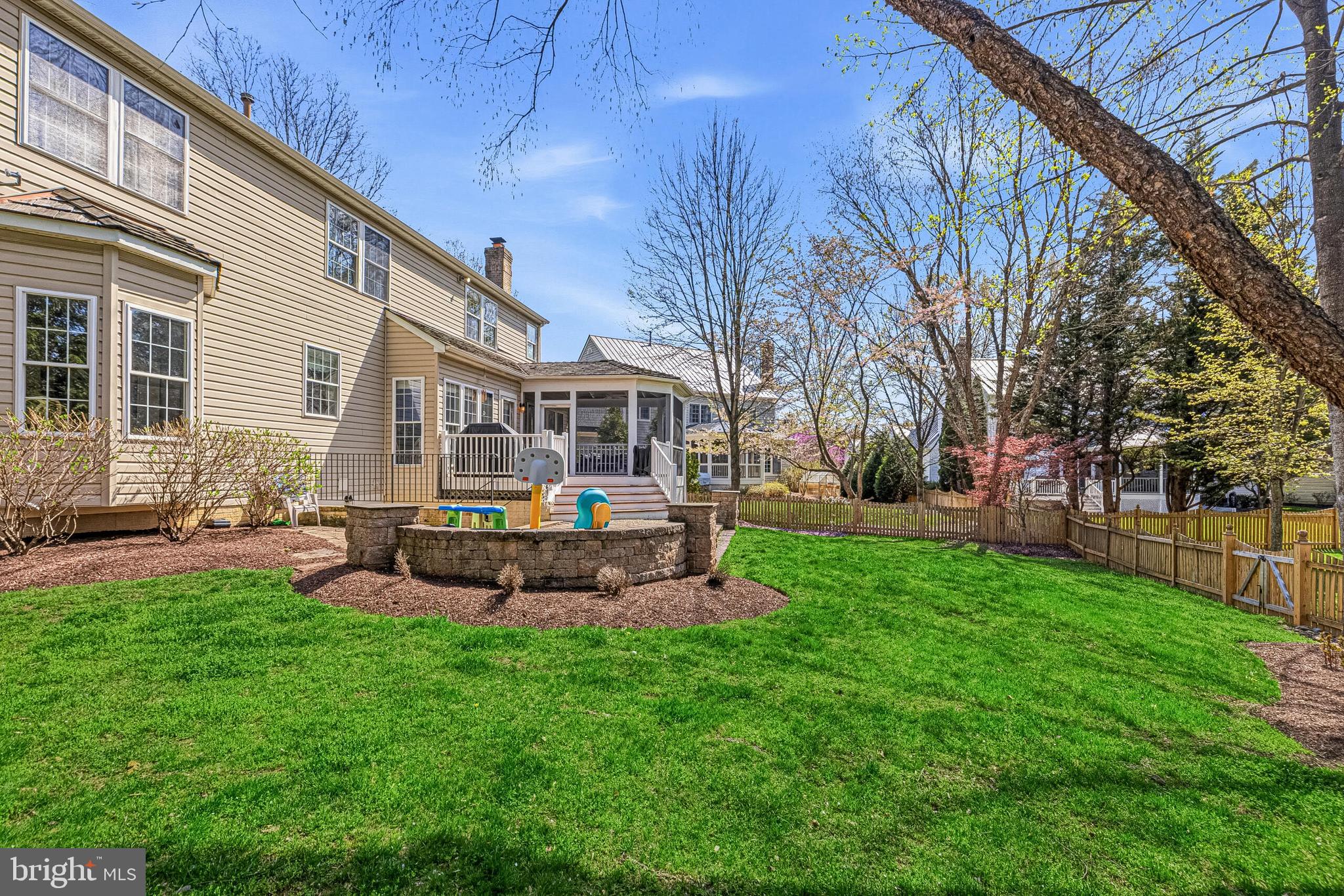 1403 Harle Place Southwest Leesburg, VA 20175 - Photo 38 of 41 a table and chairs sitting in front of a house