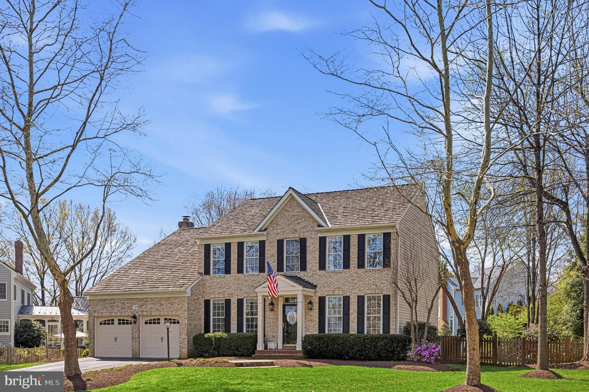 1403 Harle Place Southwest Leesburg, VA 20175 - Photo 41 of 41 a front view of brick house with a yard