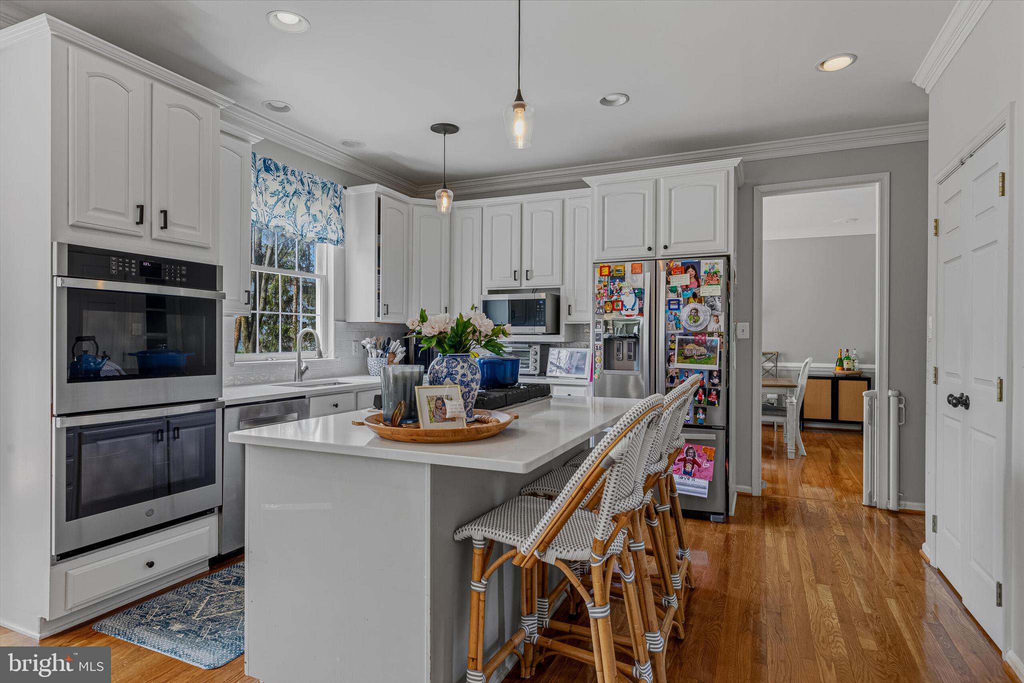1403 Harle Place Southwest Leesburg, VA 20175 - Photo 5 of 41 a kitchen with stainless steel appliances granite countertop a refrigerator and a stove top oven