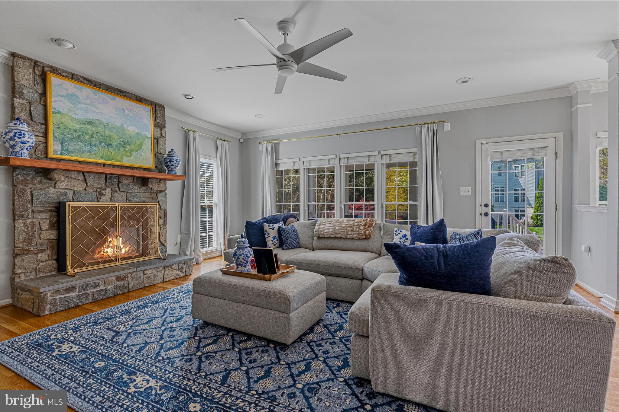 1403 Harle Place Southwest Leesburg, VA 20175 - Photo 10 of 41 a living room with furniture a flat screen tv and a fireplace