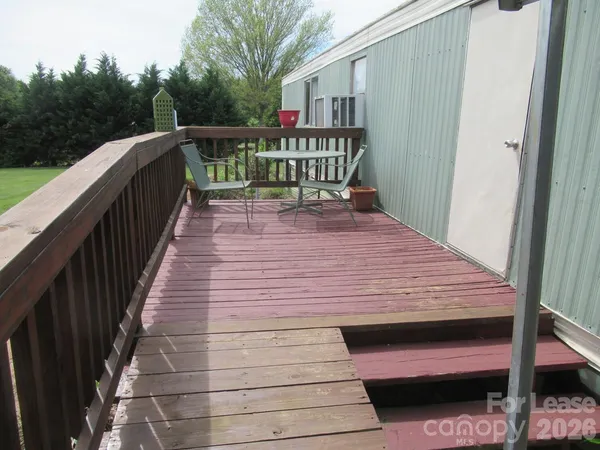 a balcony with wooden floor