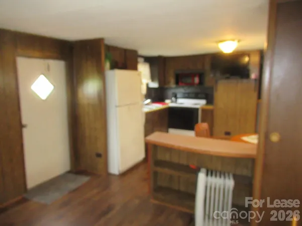 a kitchen with a refrigerator and a sink