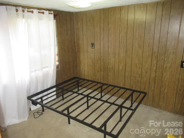 a view of a room with wooden walls