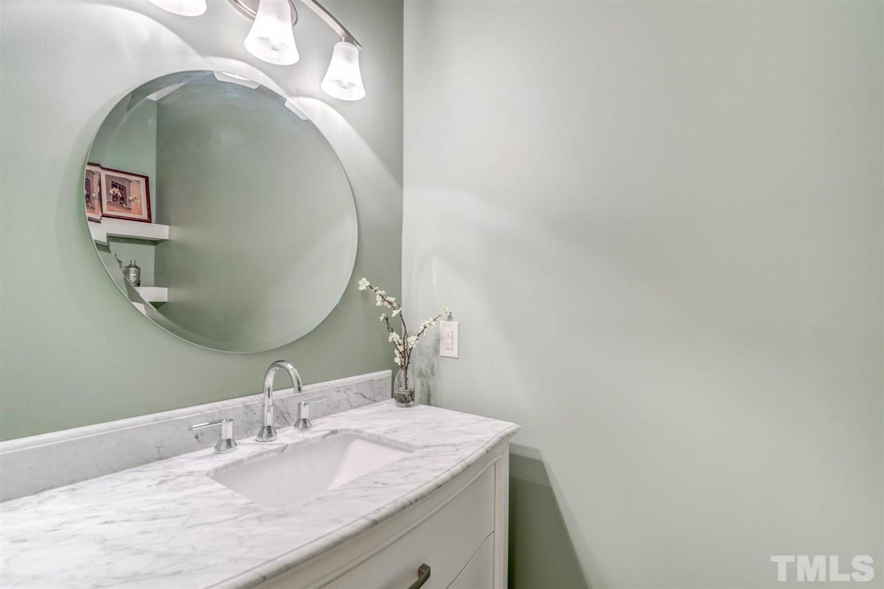 3606 Burwell Rollins Circle Raleigh, NC 27612 - Photo 15 of 30 a bathroom with a granite countertop sink and mirror