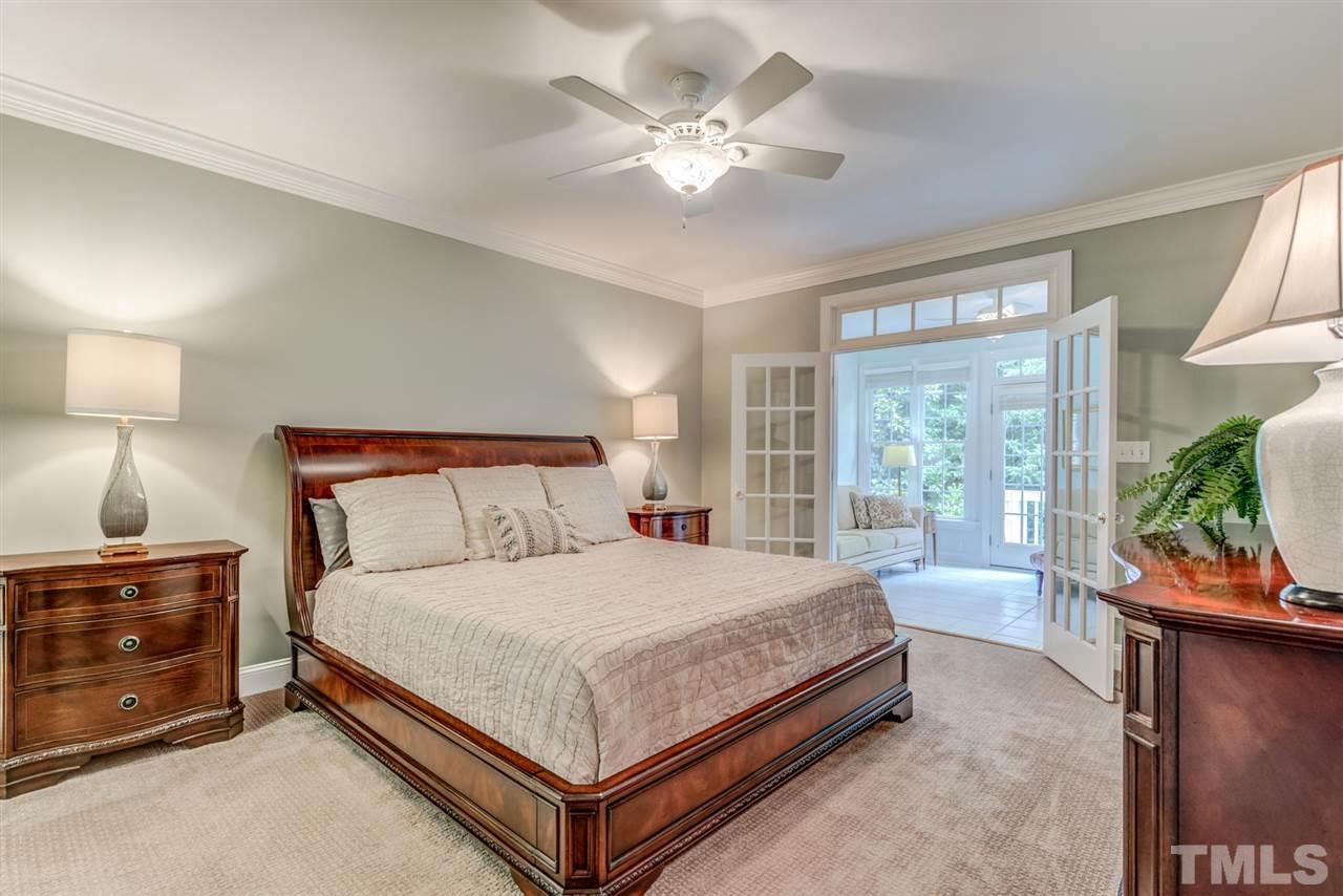 3606 Burwell Rollins Circle Raleigh, NC 27612 - Photo 16 of 30 a bedroom with a large bed and a tv on a dresser