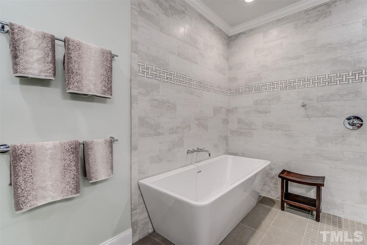 3606 Burwell Rollins Circle Raleigh, NC 27612 - Photo 19 of 30 a white bath tub sitting next to a white sink