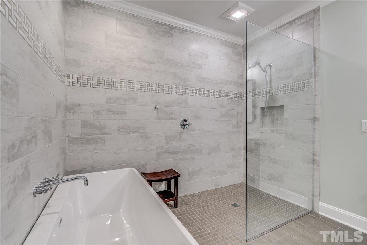 3606 Burwell Rollins Circle Raleigh, NC 27612 - Photo 20 of 30 a bathroom with a bathtub and a shower