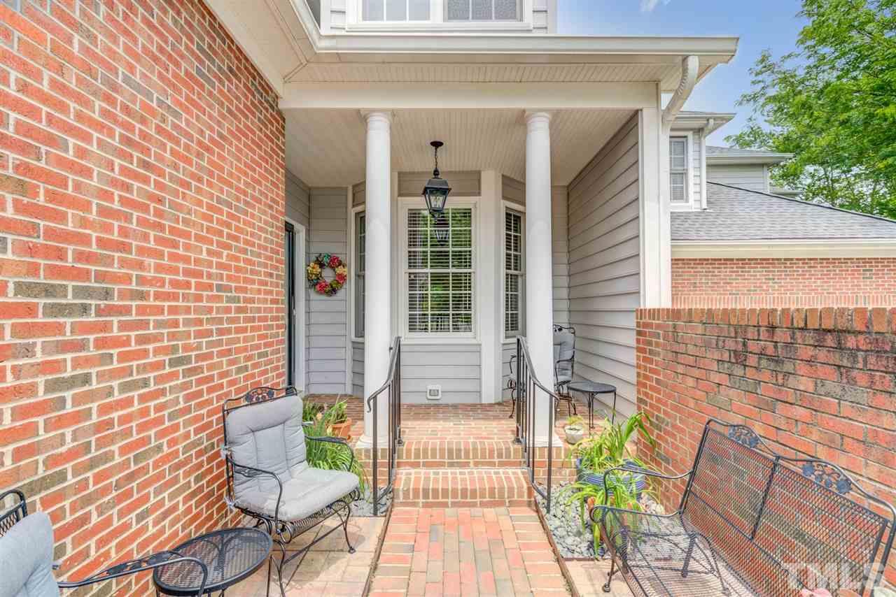 3606 Burwell Rollins Circle Raleigh, NC 27612 - Photo 3 of 30 a front view of a house with outdoor seating