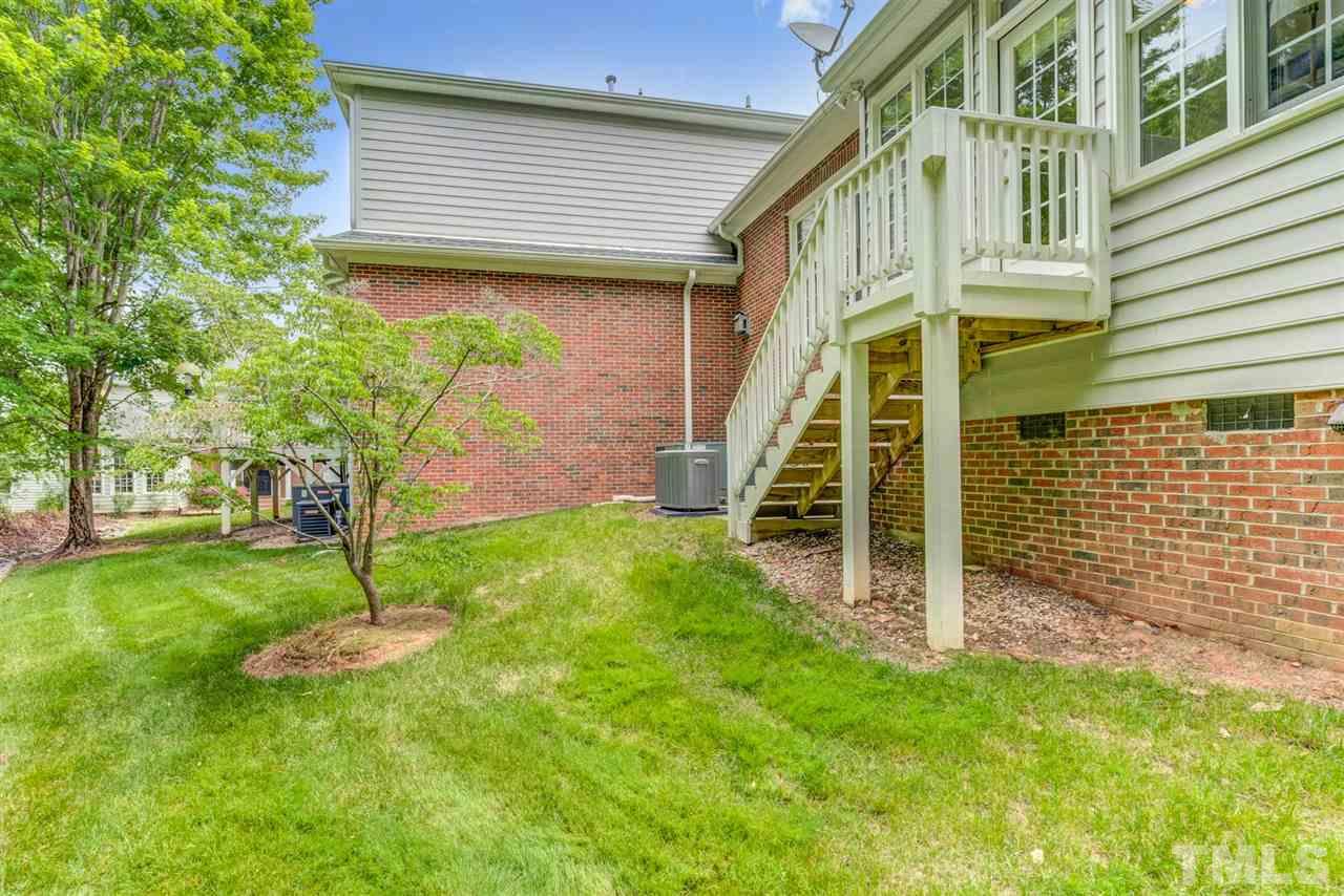 3606 Burwell Rollins Circle Raleigh, NC 27612 - Photo 29 of 30 a view of a house with a backyard