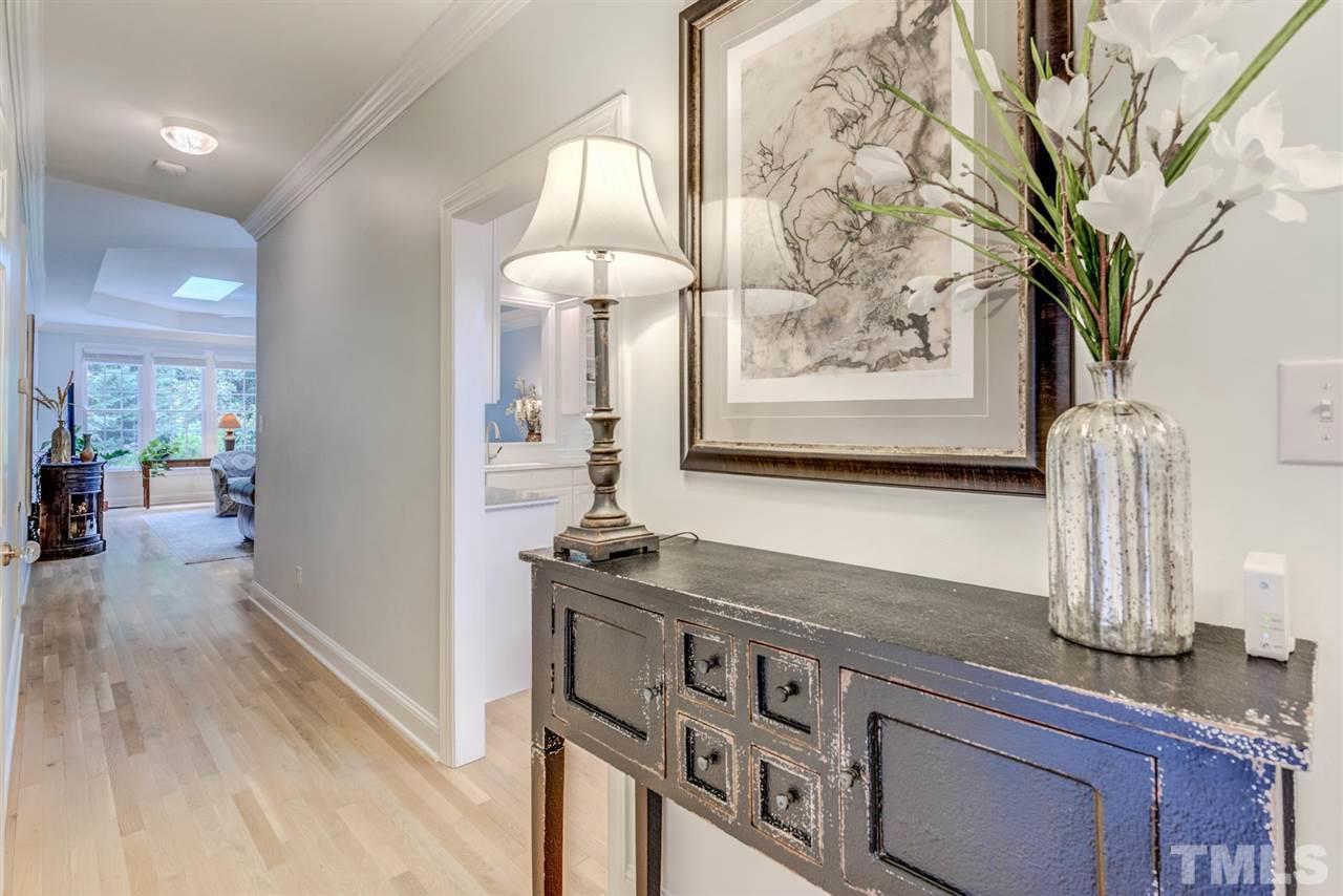 3606 Burwell Rollins Circle Raleigh, NC 27612 - Photo 4 of 30 a kitchen with stainless steel appliances granite countertop a sink a stove and a wooden floor