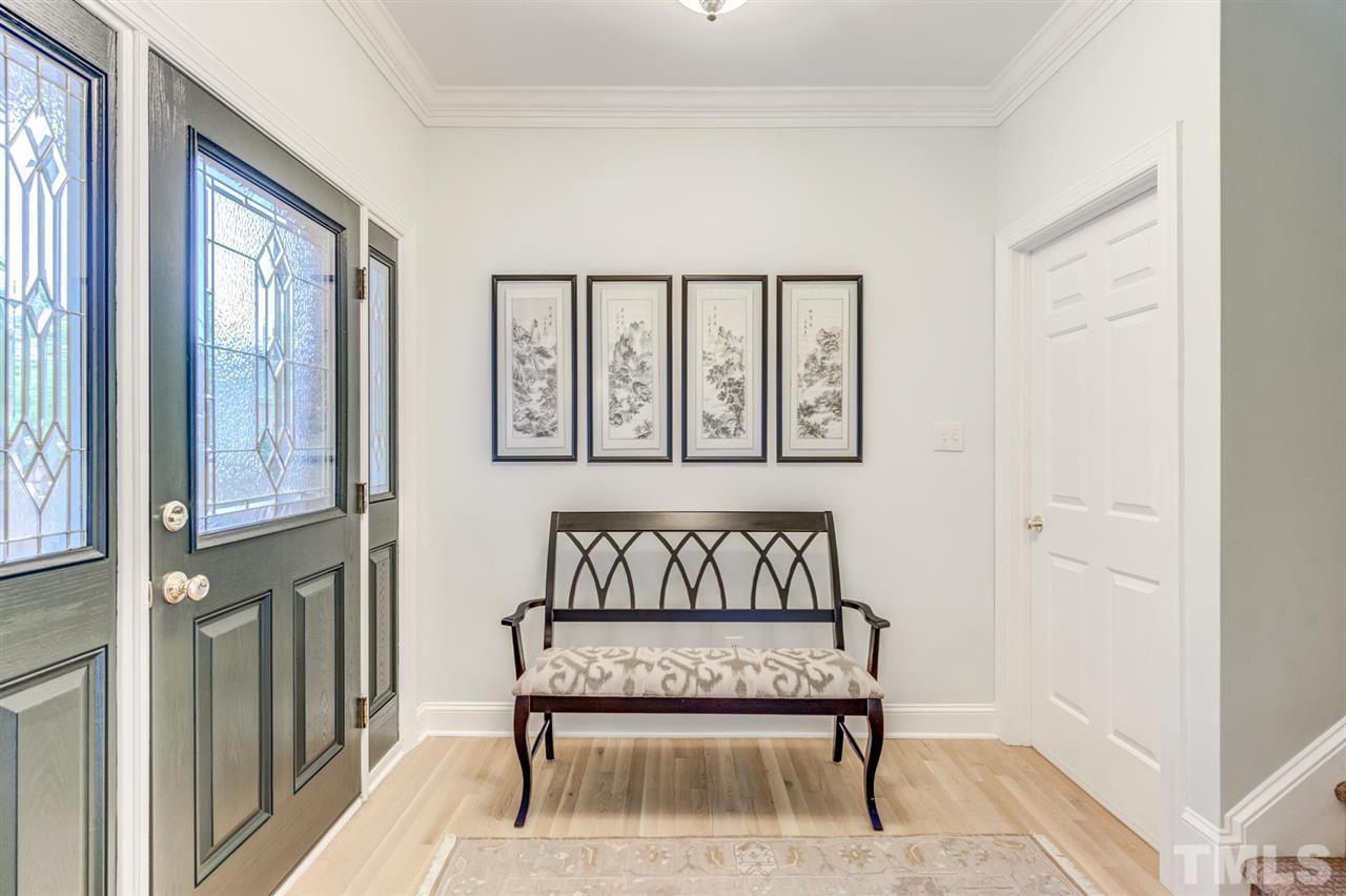 3606 Burwell Rollins Circle Raleigh, NC 27612 - Photo 5 of 30 a bench sitting in front of a door