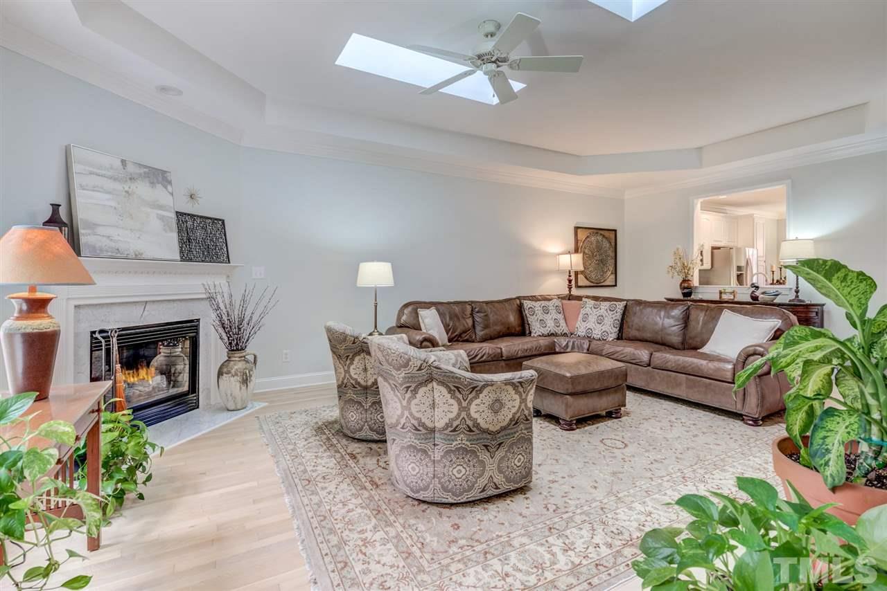 3606 Burwell Rollins Circle Raleigh, NC 27612 - Photo 8 of 30 a living room with furniture and a fireplace