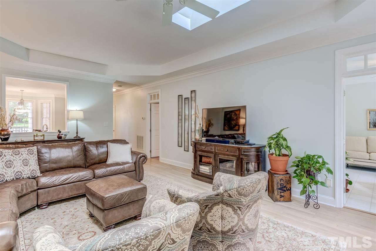 3606 Burwell Rollins Circle Raleigh, NC 27612 - Photo 9 of 30 a living room with furniture and a flat screen tv