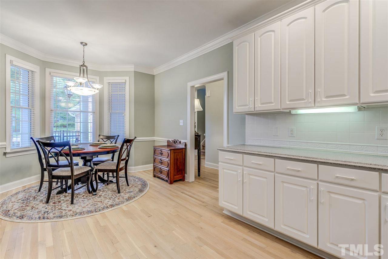 3606 Burwell Rollins Circle Raleigh, NC 27612 - Photo 10 of 30 a view of a dining room with furniture and chandelier