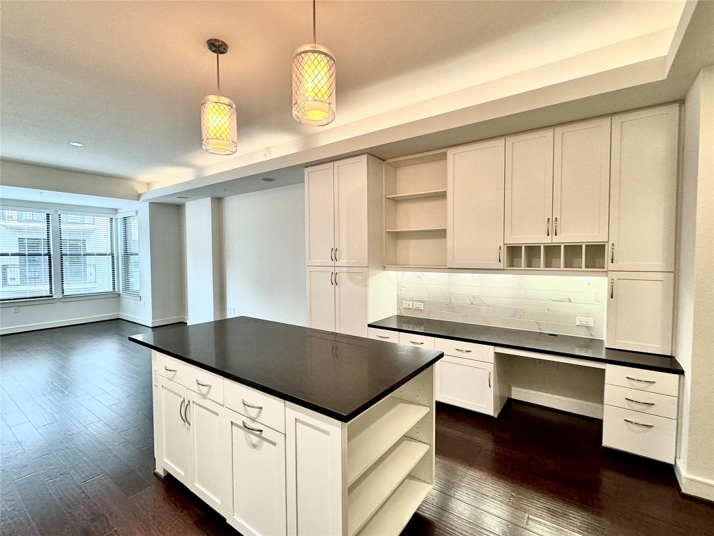 2303 Mid Lane, Unit 318 Houston, TX 77027 - Photo 2 of 25 a kitchen with stainless steel appliances granite countertop a sink a stove and a wooden floors