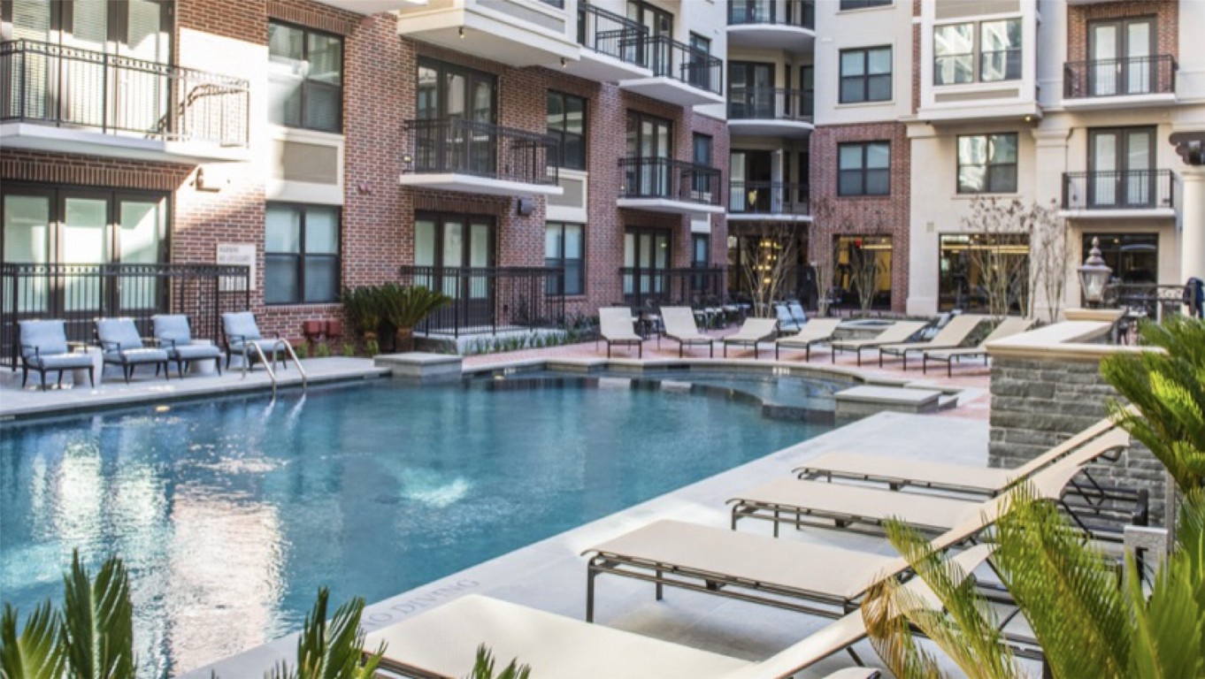 2303 Mid Lane, Unit 318 Houston, TX 77027 - Photo 24 of 25 a view of a lake with a house