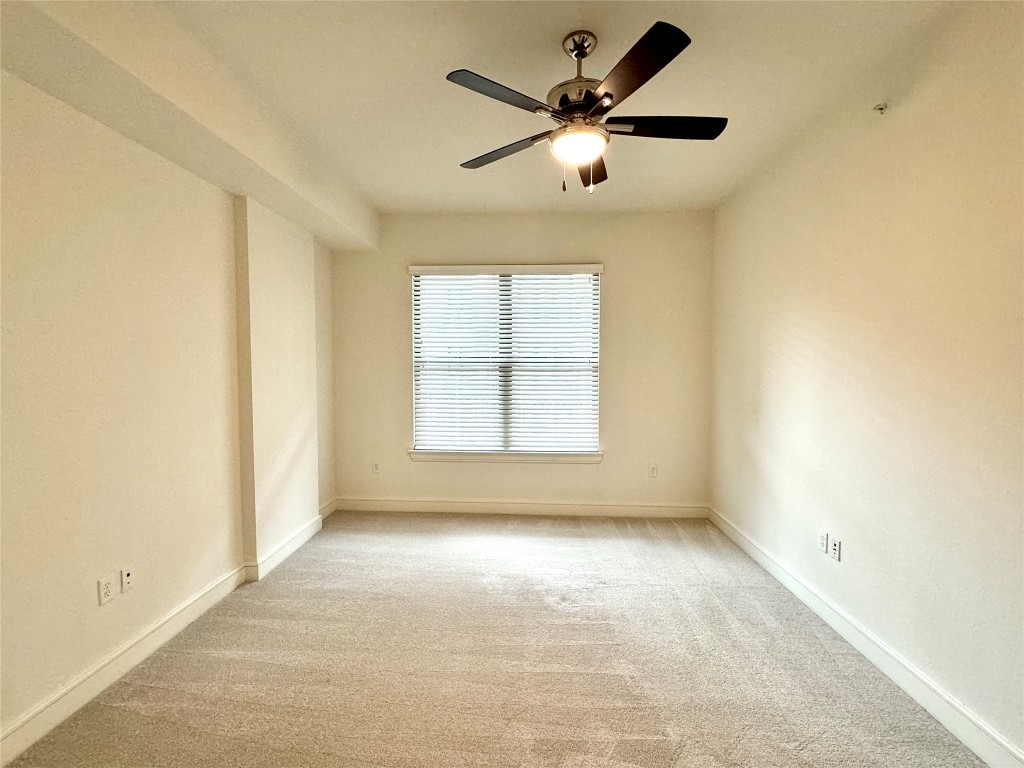 2303 Mid Lane, Unit 318 Houston, TX 77027 - Photo 10 of 25 wooden floor in an empty room with a window