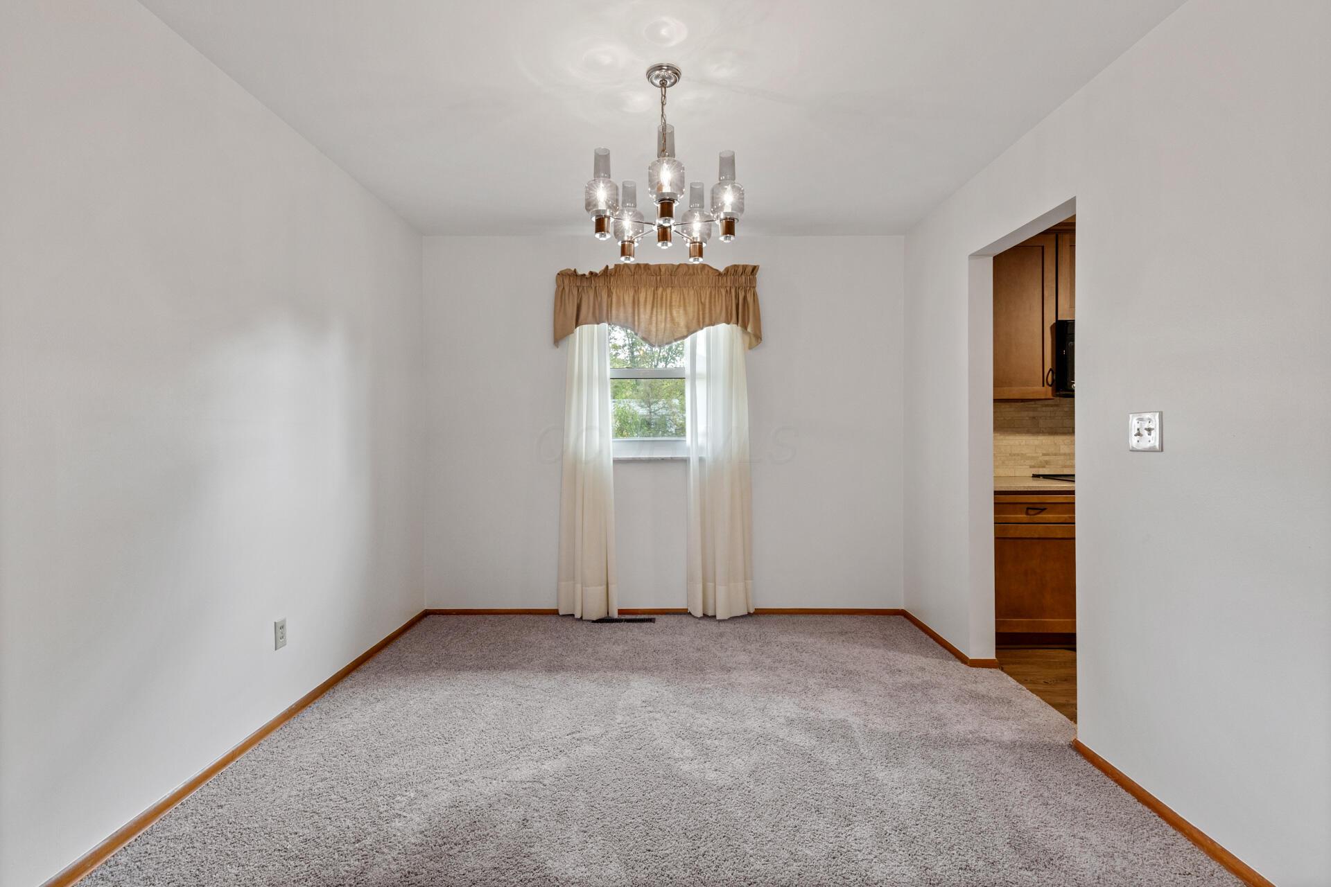 4816 Bourke Road Columbus, OH 43229 - Photo 21 of 44 Formal dining room with Chandelier! New carpeting and fresh paint!