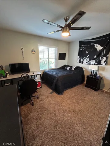 a view of staircase with railing and white walls