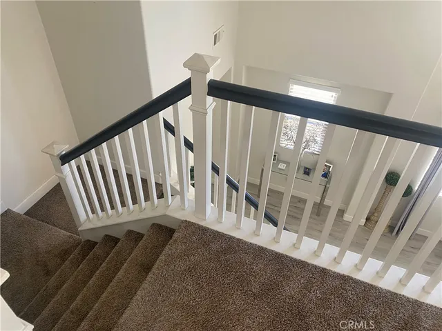 a view of an entryway with wooden floor