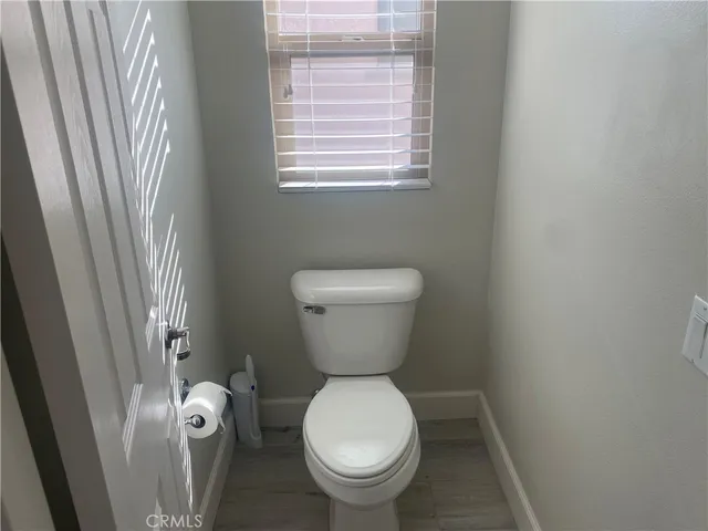 a bedroom with bed couch and window