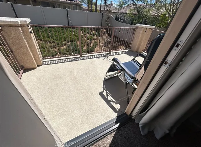 a bedroom with a bed and a desk
