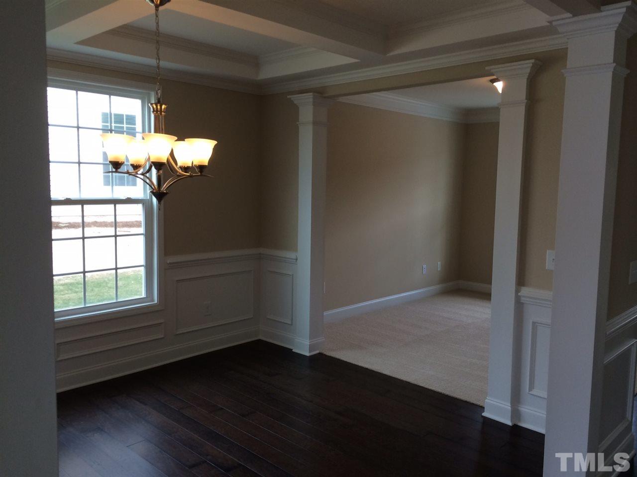 7464 Randshire Way Raleigh, NC 27616 - Photo 2 of 25 a view of empty room with wooden floor and fan