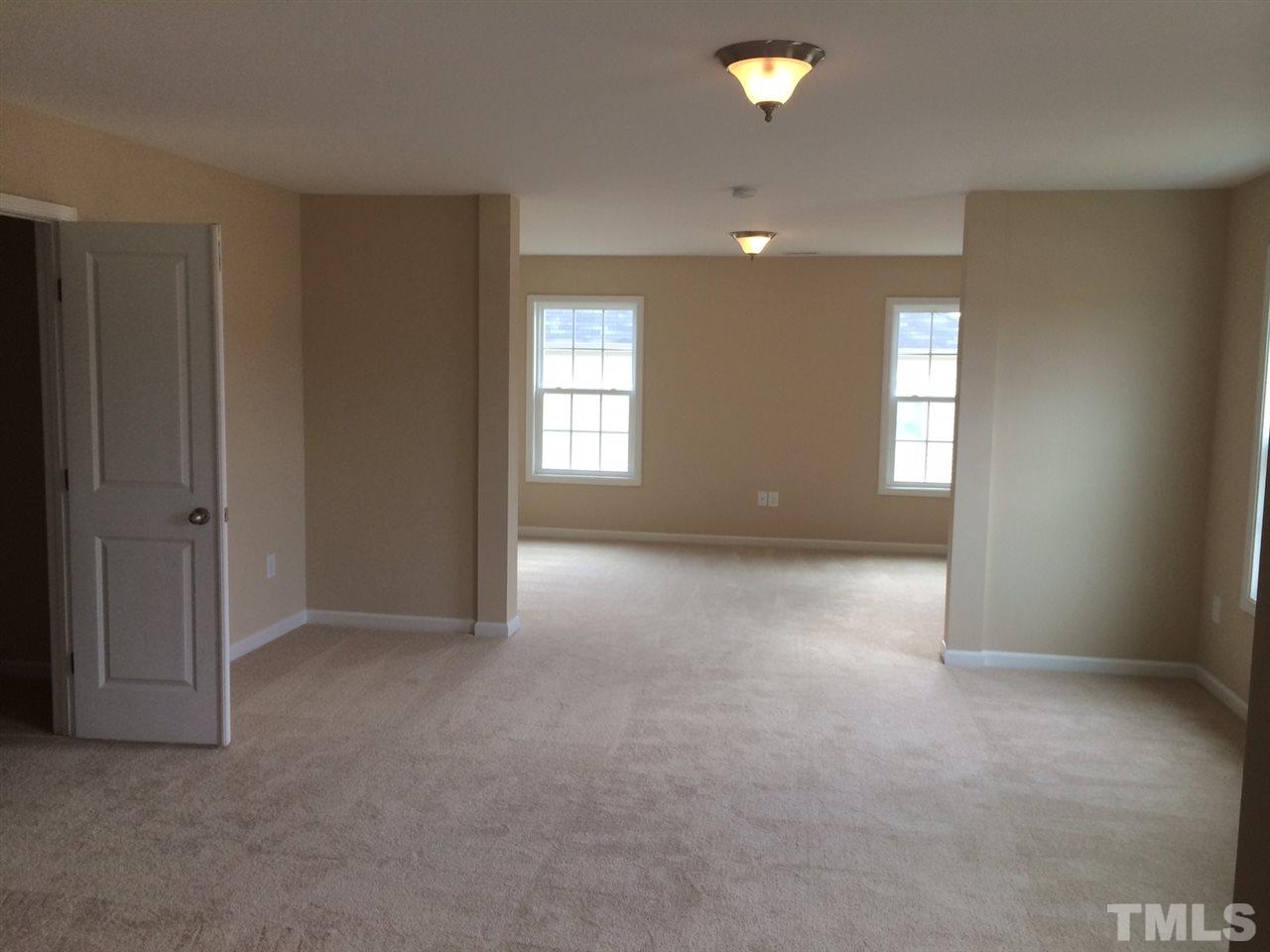 7464 Randshire Way Raleigh, NC 27616 - Photo 6 of 25 an empty room with windows and closet