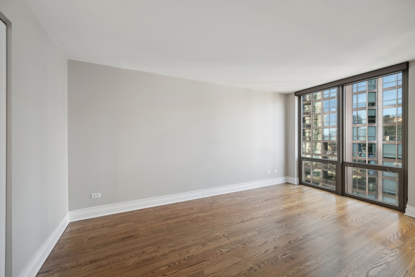 2 East Erie Street, Unit 1501 Chicago, IL 60611 - Photo 14 of 18 a view of an empty room with a window
