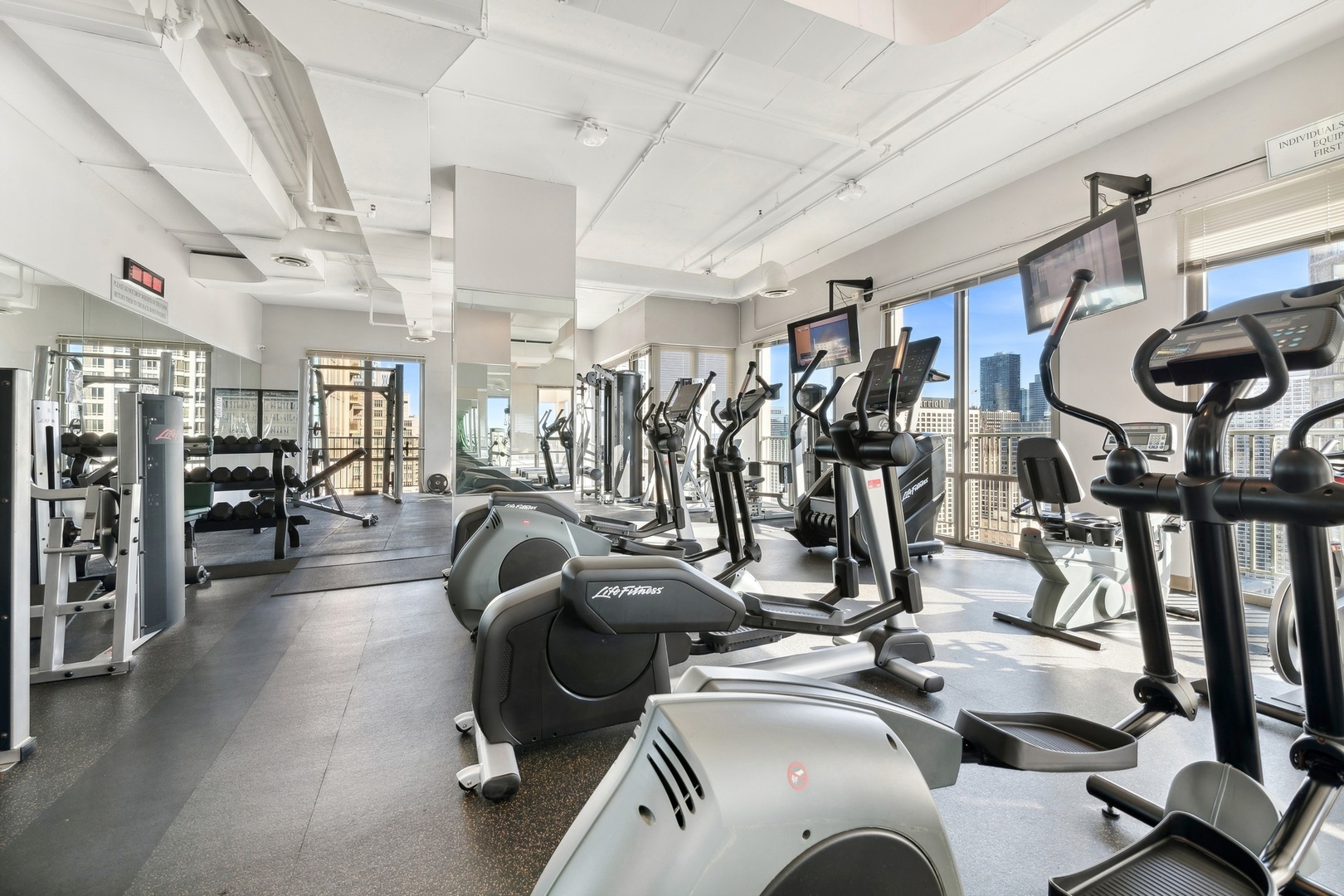 2 East Erie Street, Unit 1501 Chicago, IL 60611 - Photo 17 of 18 a view of a room with gym equipment