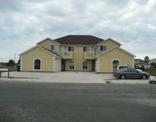 a house view with a garden space