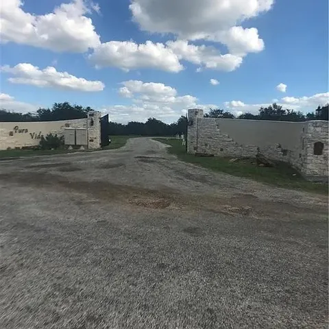 a view of a big yard with lots of buildings