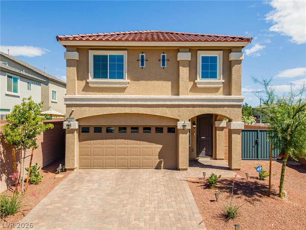 5510 Ripple Ridge Avenue Las Vegas, NV 89139 - Photo 2 of 45 This charming home features a tiled roof and an inviting paved driveway.