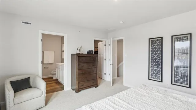 a bedroom with a bed and a couch