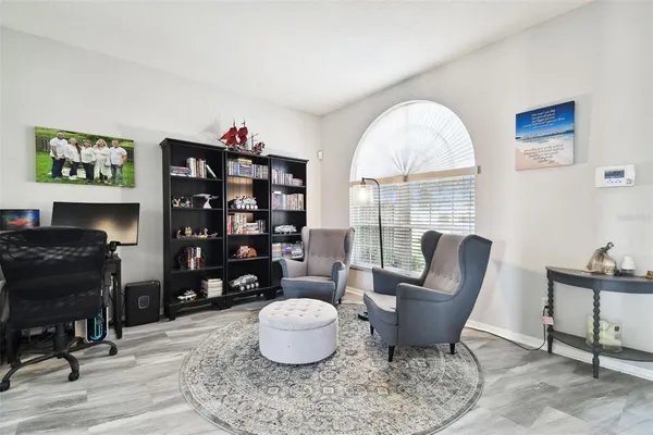 a dining room with furniture and window